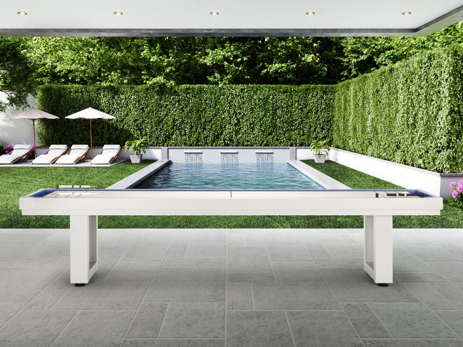 American Heritage Lanai 9' Outdoor Shuffleboard Table in Pearl White by patio, pool, and garden.