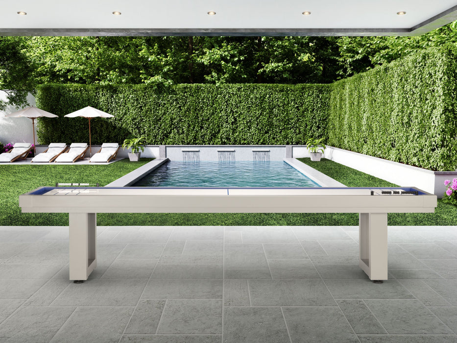 American Heritage Lanai 12' Outdoor Shuffleboard Table in Oyster Grey on a patio by the pool.