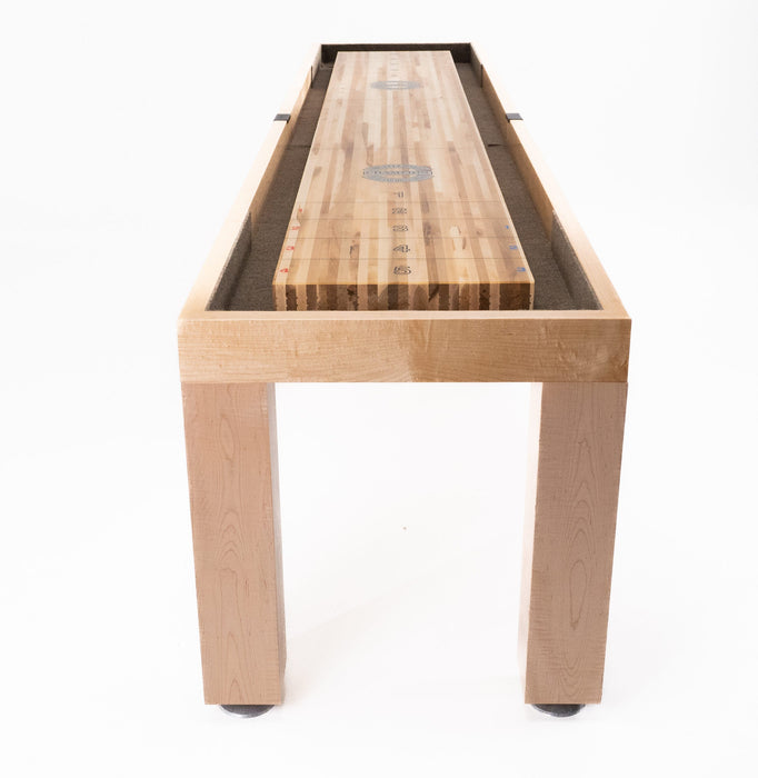 Champion 20' Richland Shuffleboard Table by Champion, solid wood, end view on white background.