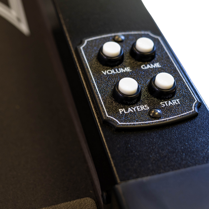 Control panel with buttons labeled 'Volume', 'Game', 'Players', and 'Start' on a black surface.